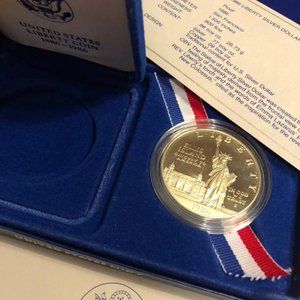 1986 United States Liberty Silver Dollar, U.S mint sealed original capsule w/Vel